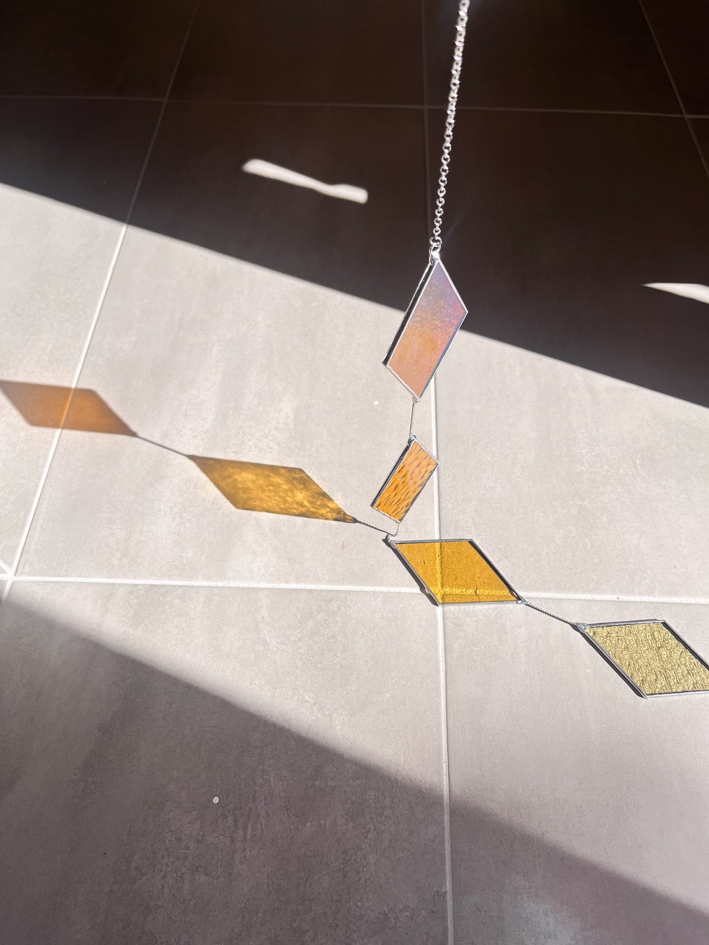 Handmade stained glass pendant with three elements attached by a silver chain. You can hang this panel in a window, on the wall as decor or even an outside patio. Custom made for Thread Spun by Culotta Creations.