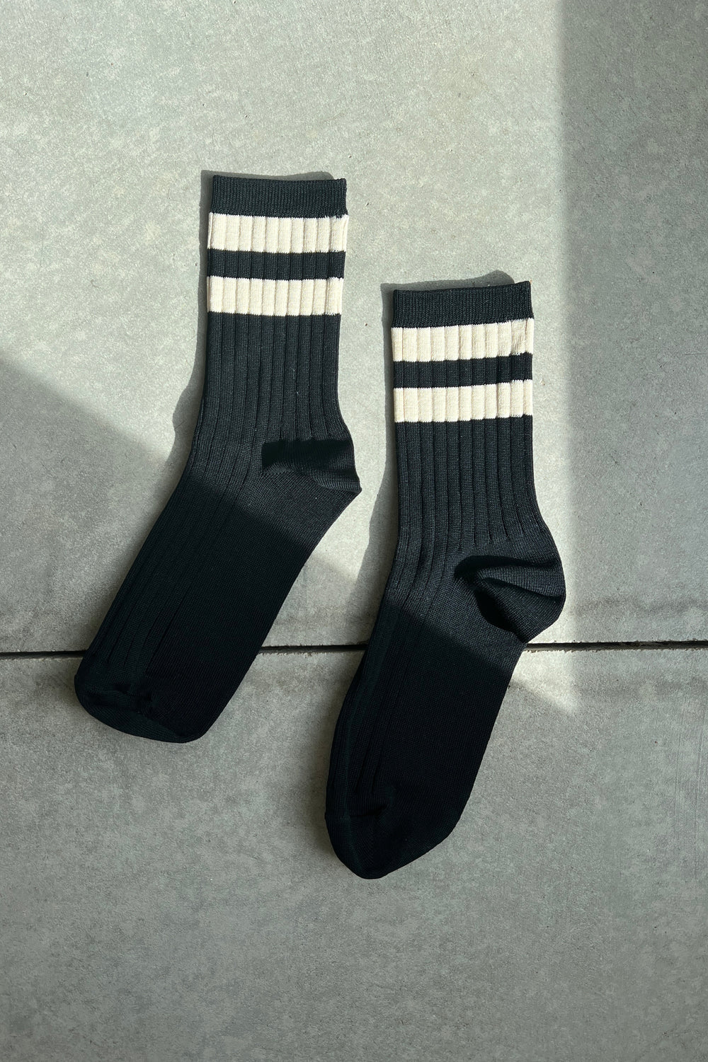 Her Varsity Socks is a varsity striped version of Le Bon's OG Her Socks which are classically ribbed, perfect height, cotton blend durable, chic go to socks. Add an understated sporty touch to any look with this bold stripe contrast version of Her Socks.