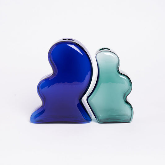 Expertly crafted with meticulous attention to detail, Manu Nanu's Interlocking Vases are sturdy and long-lasting, made with borosilicate glass. Coblat Blue/Teal.