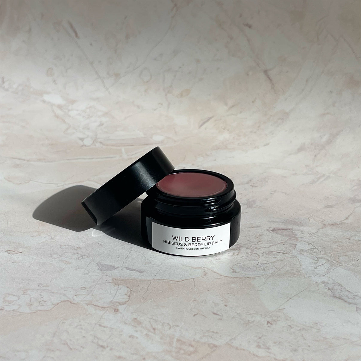 salud wild berry lip balm / The best organic lip balm for the natural lip hydration. Wild Berry is a soft blend of wild blueberry and hibiscus flowers. Hand poured in California.