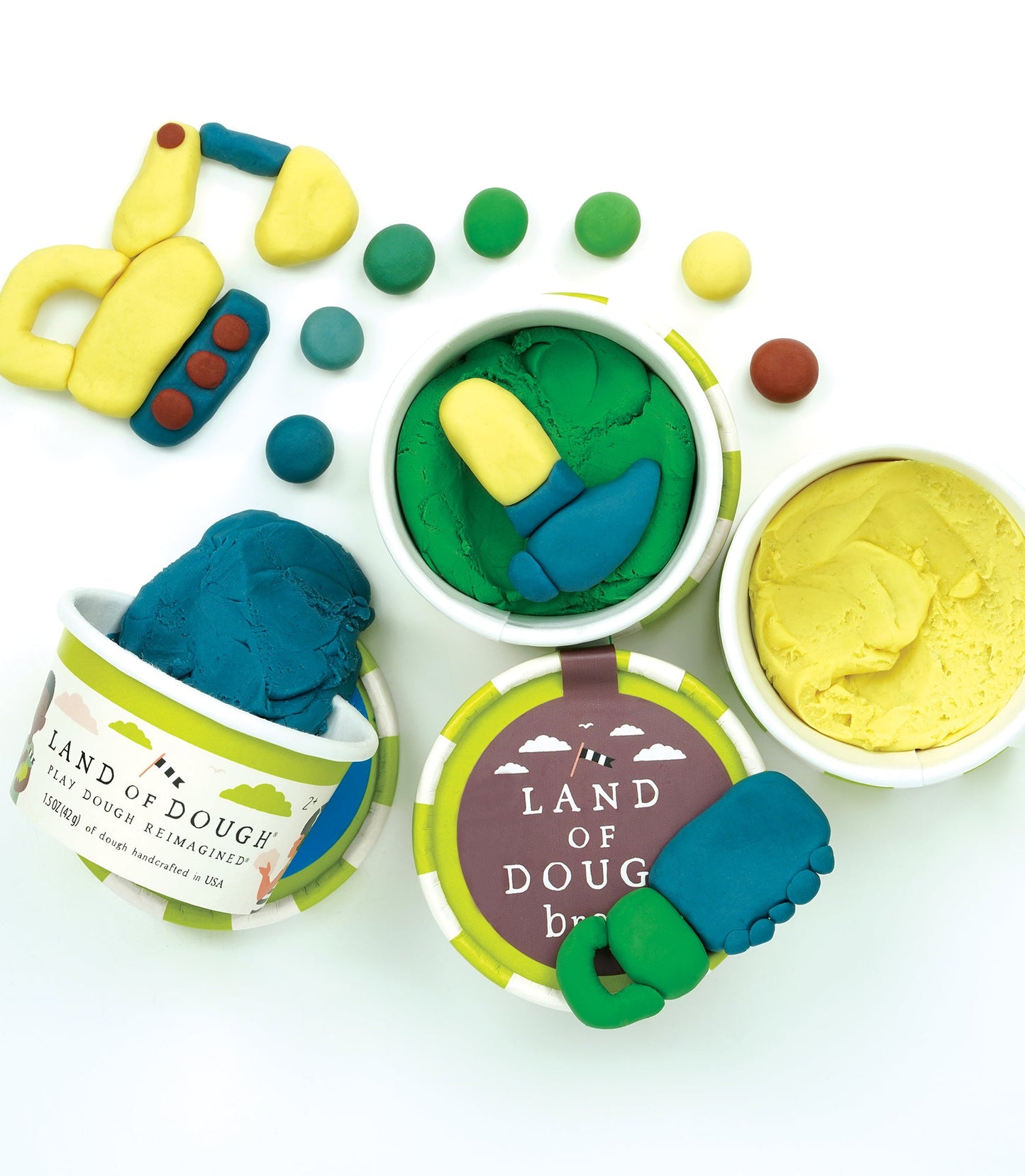 Heavy-duty imagination! Land of Dough® Construction pack includes 4 colors to mix, shape, and create. This dough set has all the right tools to build the next big project. Land of Dough® is made of all-natural dough and colors, compostable glitters, and calming essential oils in eco-friendly packaging.