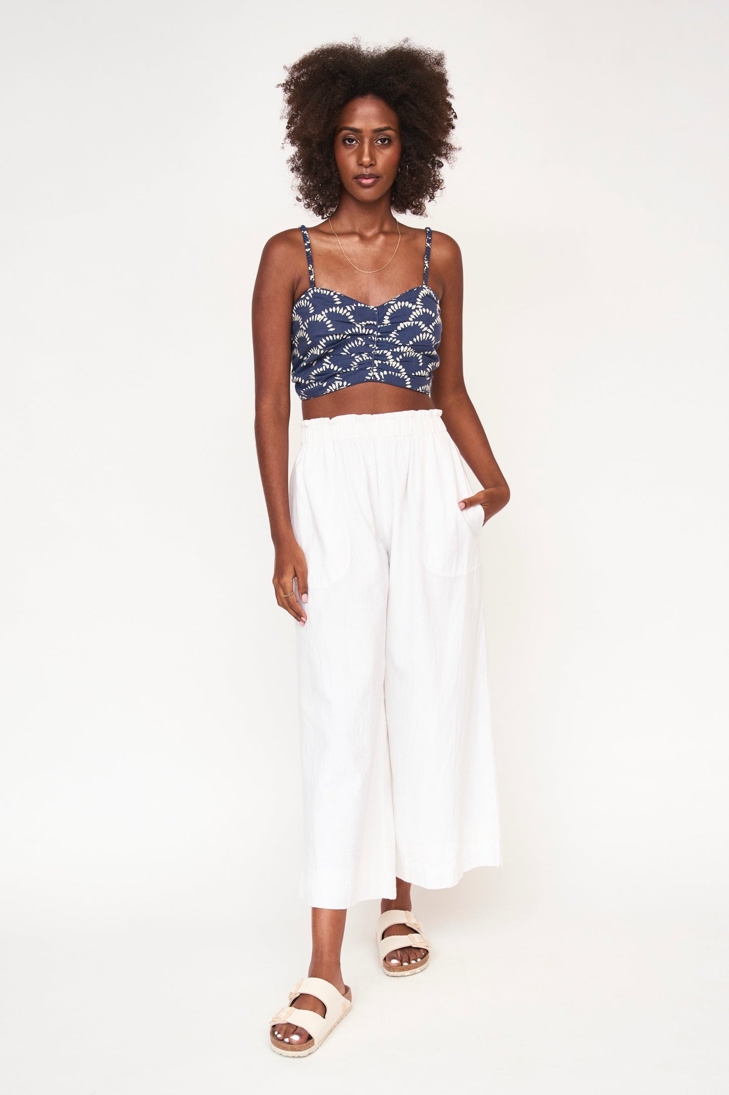 This paperbag waist pant is comfy, roomy, high waisted and wide legged. Wear it seaside with a swimsuit or with your favorite blouse tucked in. Ethically made in India.