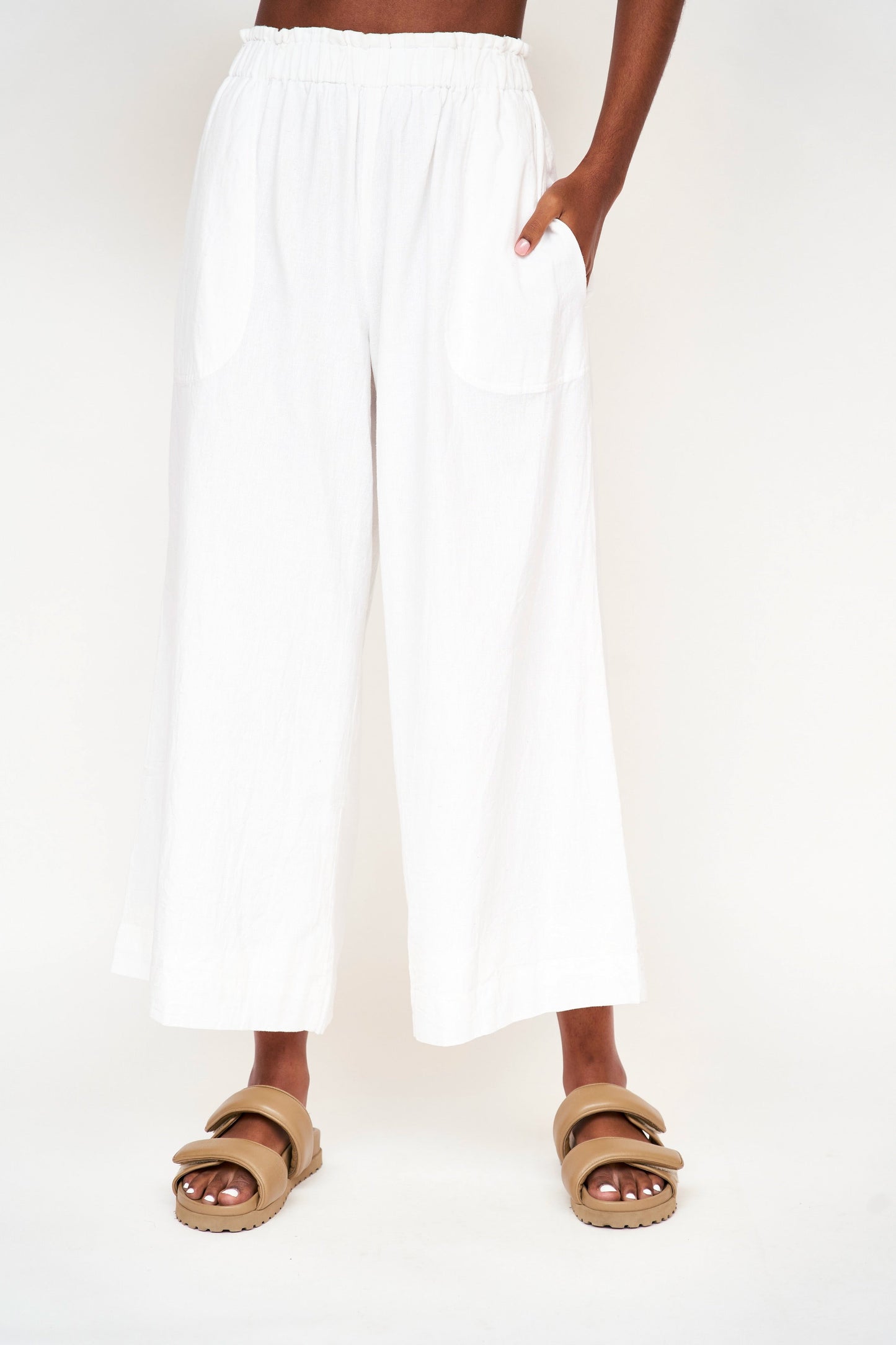 This paperbag waist pant is comfy, roomy, high waisted and wide legged. Wear it seaside with a swimsuit or with your favorite blouse tucked in. Ethically made in India.