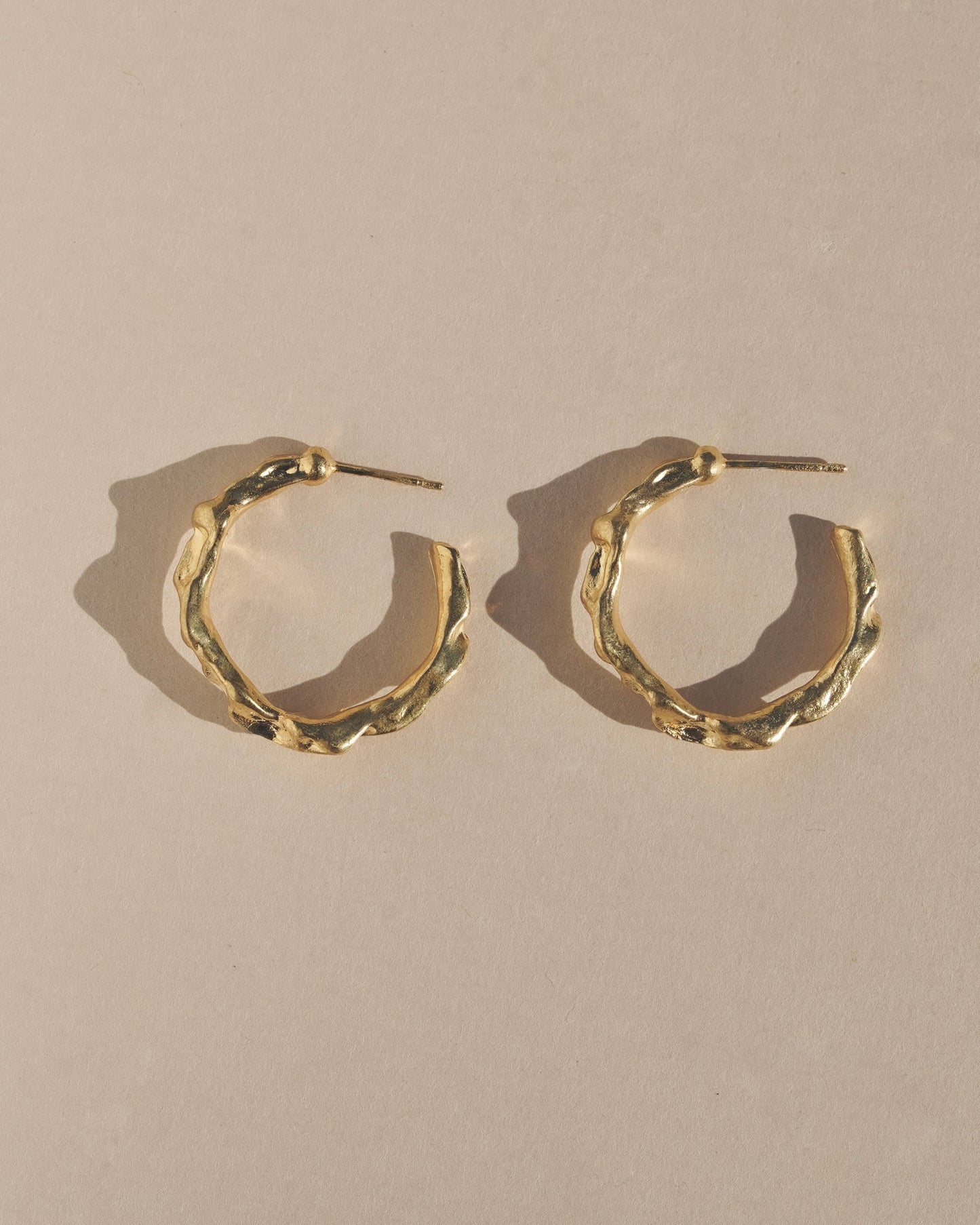 Edgy and modern with lots of texture, these hoops are beautiful and easy to wear. Fluid hoop earrings with wavy dimension in the perfect statement size. Handmade in the Santa Cruz Mountains.