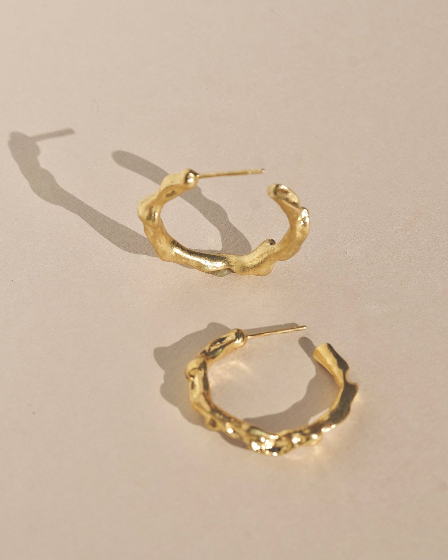 Edgy and modern with lots of texture, these hoops are beautiful and easy to wear. Fluid hoop earrings with wavy dimension in the perfect statement size. Handmade in the Santa Cruz Mountains.