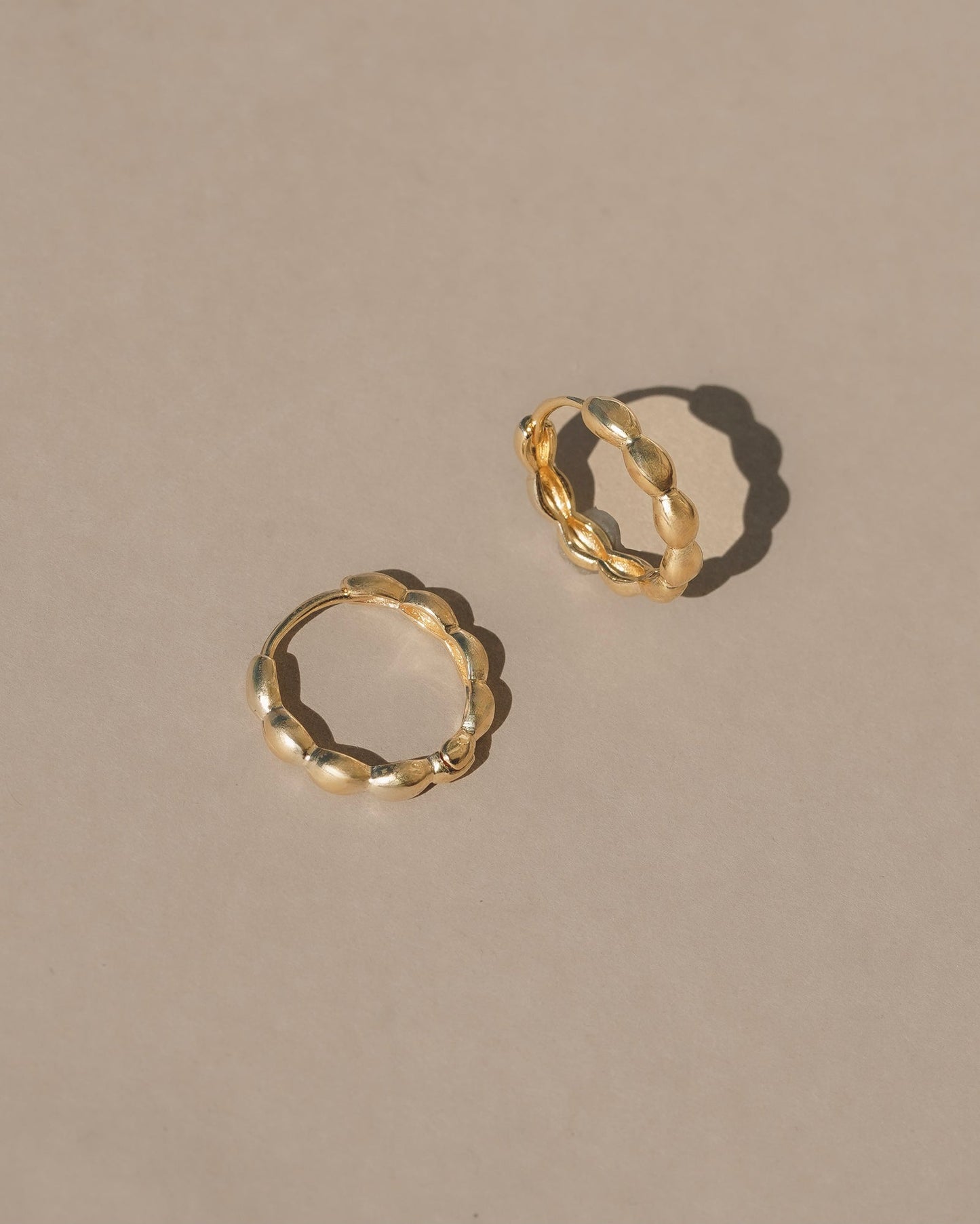 14k gold vermeil petal earrings / Simple floral inspired hollow hinged hoops, light weight every day comfort and organic ease. Handmade in the Santa Cruz mountains.