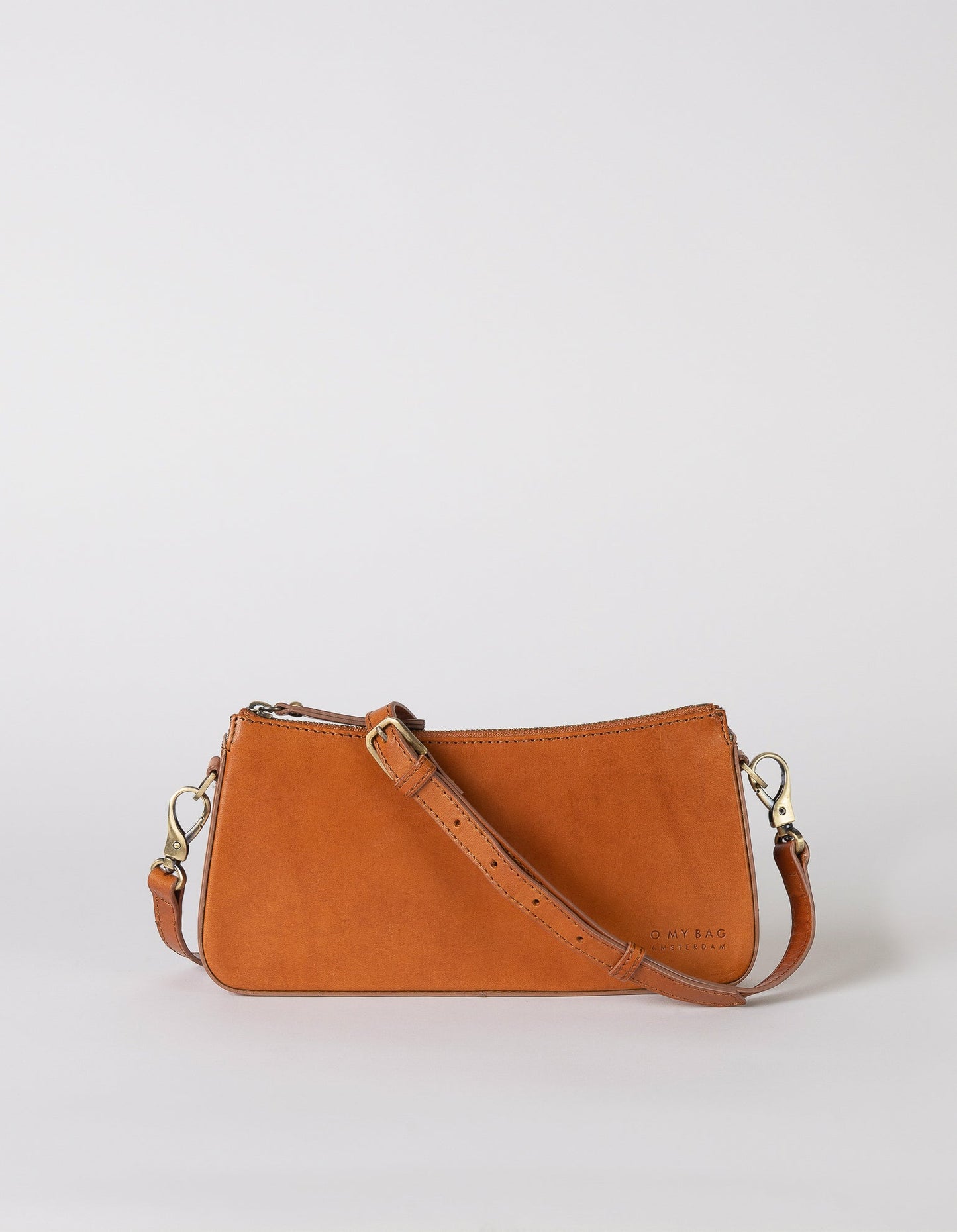 A bag that gives you an irreplaceable look and feel of a fun night out? Here she is! Small but mighty, Taylor has a compact and convenient design optimized to fit your most important belongings. She comes with one short strap and one long adjustable strap for a crossbody look. Made in India.