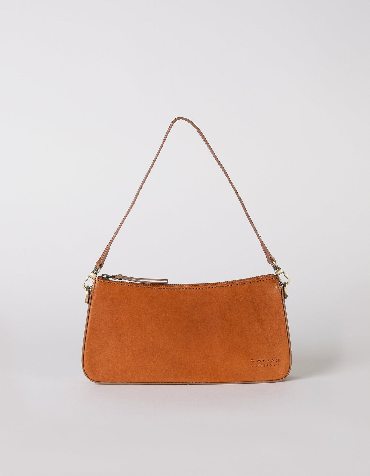 A bag that gives you an irreplaceable look and feel of a fun night out? Here she is! Small but mighty, Taylor has a compact and convenient design optimized to fit your most important belongings. She comes with one short strap and one long adjustable strap for a crossbody look. Made in India.