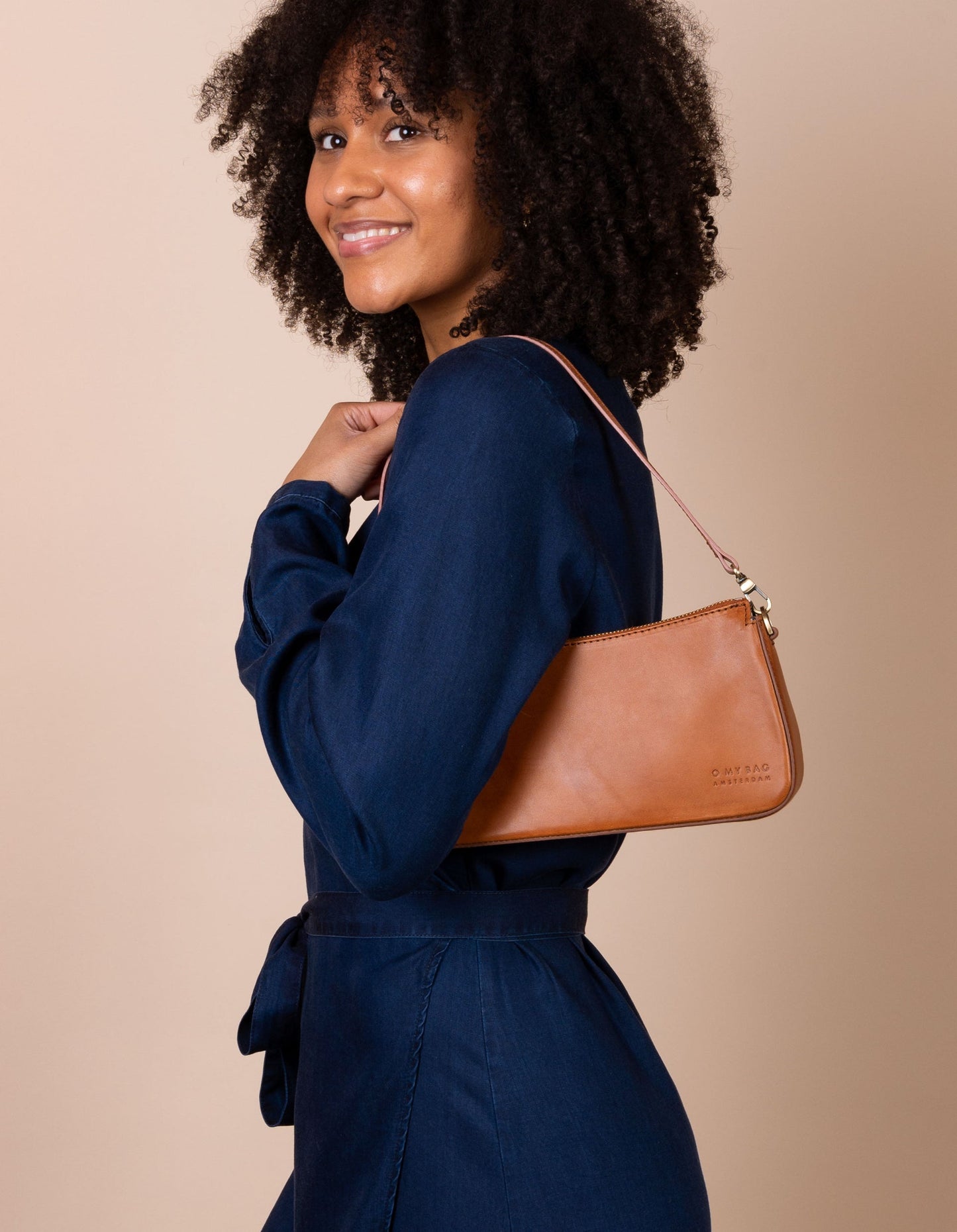 A bag that gives you an irreplaceable look and feel of a fun night out? Here she is! Small but mighty, Taylor has a compact and convenient design optimized to fit your most important belongings. She comes with one short strap and one long adjustable strap for a crossbody look. Made in India.