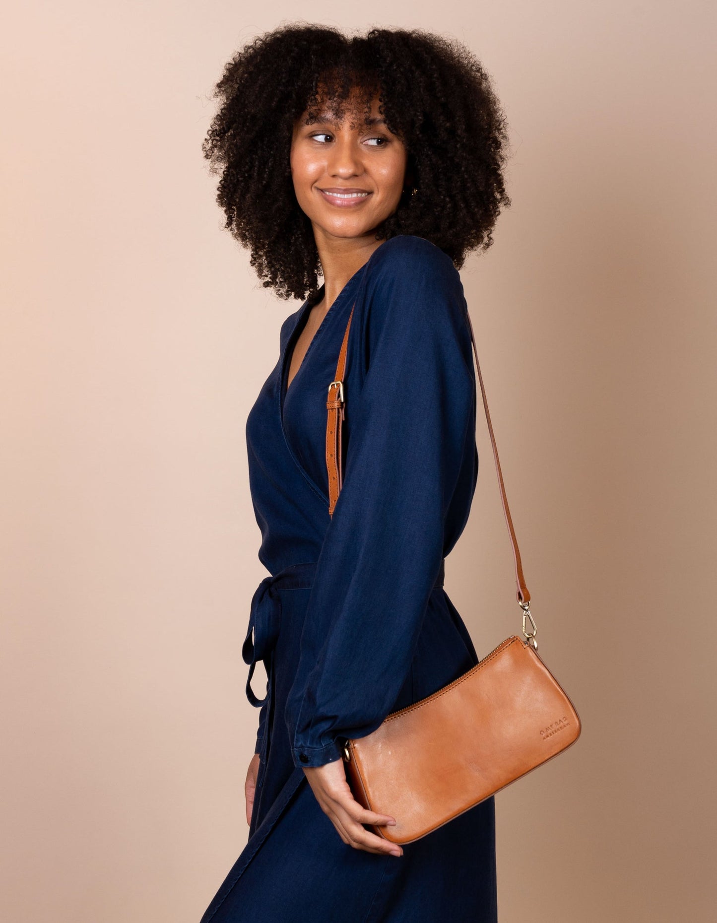 A bag that gives you an irreplaceable look and feel of a fun night out? Here she is! Small but mighty, Taylor has a compact and convenient design optimized to fit your most important belongings. She comes with one short strap and one long adjustable strap for a crossbody look. Made in India.