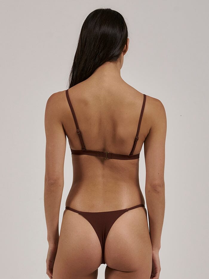 Made from eco-friendly recycled materials, the Paradise Cove Triangle Bikini Top offer an eco-conscious choice without compromising on style, so you can feel just as good as you look! Designed in Byron Bay, Australia.