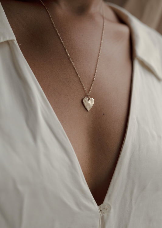 A necklace to honor the sweetness of your human heart. Smooth and polished with a slightly organic texture. Handmade in Northern California by Amanda Hunt.