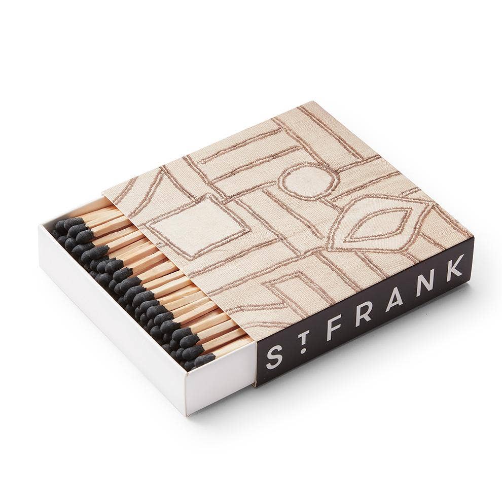 This matchbox is printed with a replica of a vintage Kuba cloth, a unique textile featuring complex designs that are created when various geometric raffia pieces are stitched to a plain raffia background. Matchbox is made from printed paper and filled with approximately 120 3.75" safety matches.