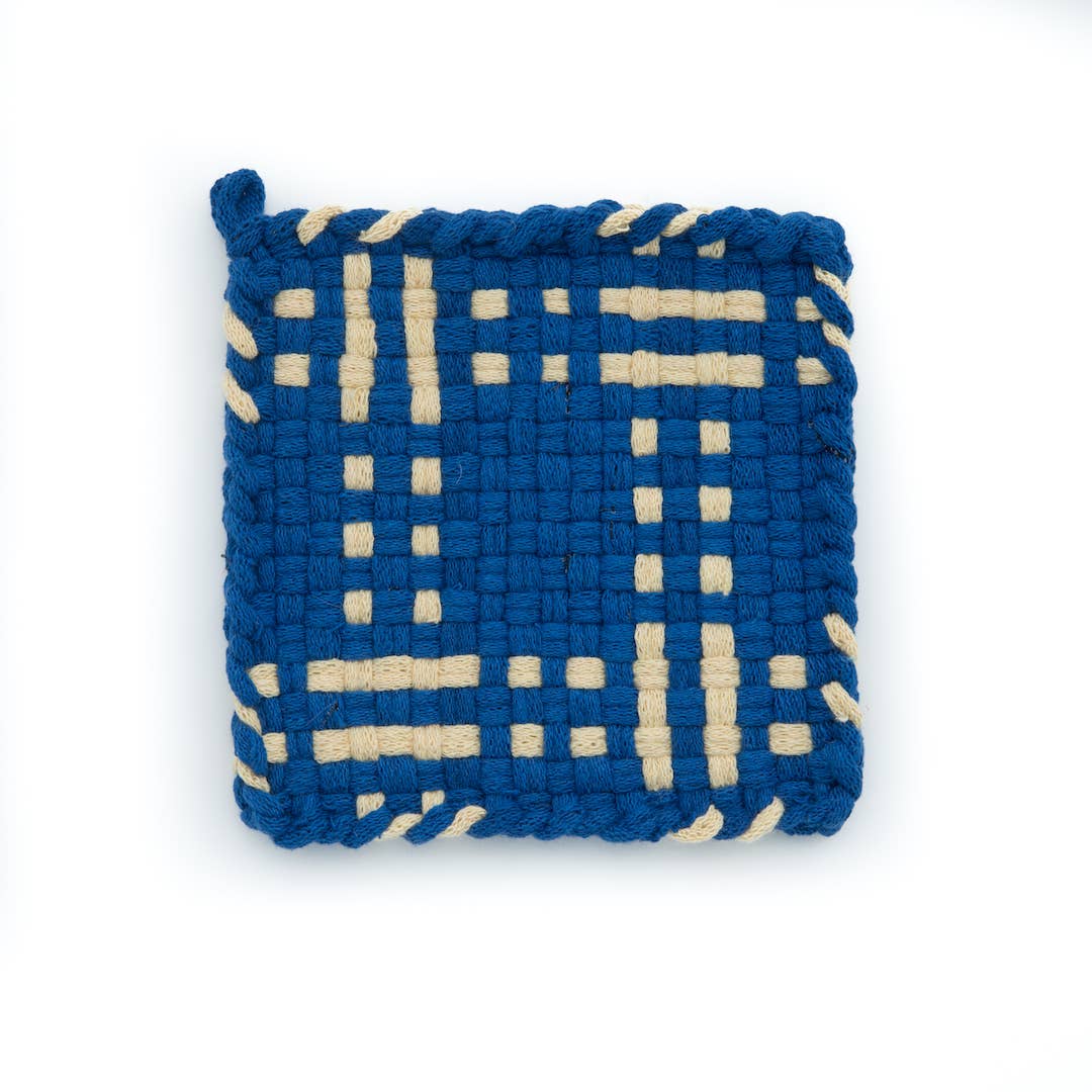 Blue and beige handmade potholder on a white background