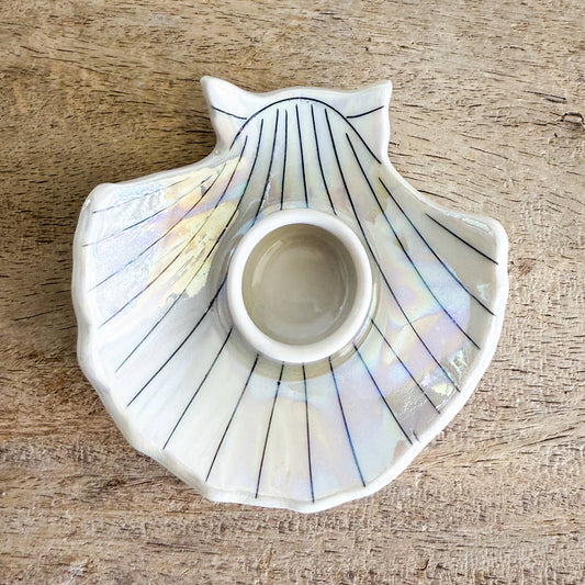 Each candle holder is hand-thrown from fine porcelain, and features hand drawn inlay and mother of pearl luster for a delicate and iridescent shine.