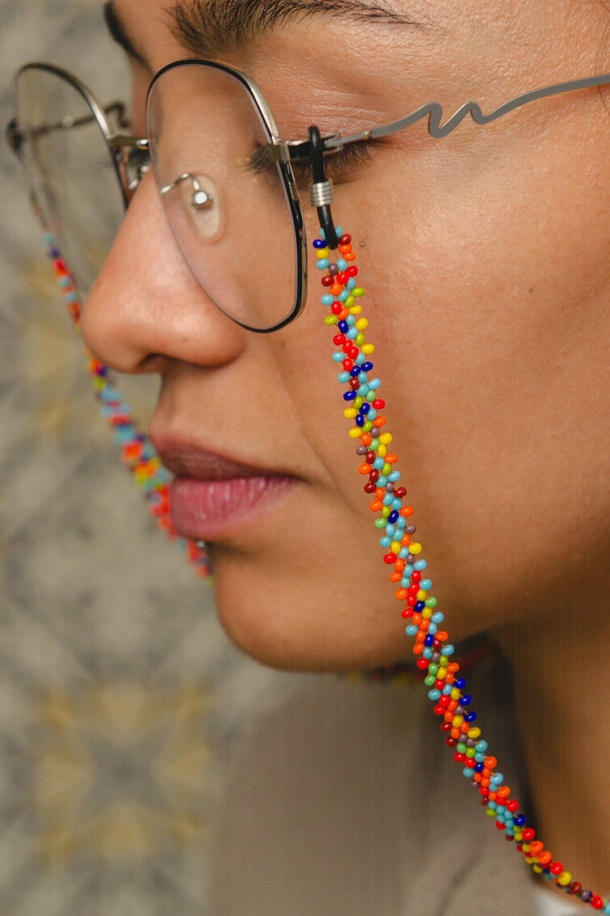 Mother Sierra's Confetti beaded glasses chain, a delightful burst of rainbow confetti colors that add a touch of playful charm to any frame. Handmade in Guatemala with Preciosa Ornela Beads.