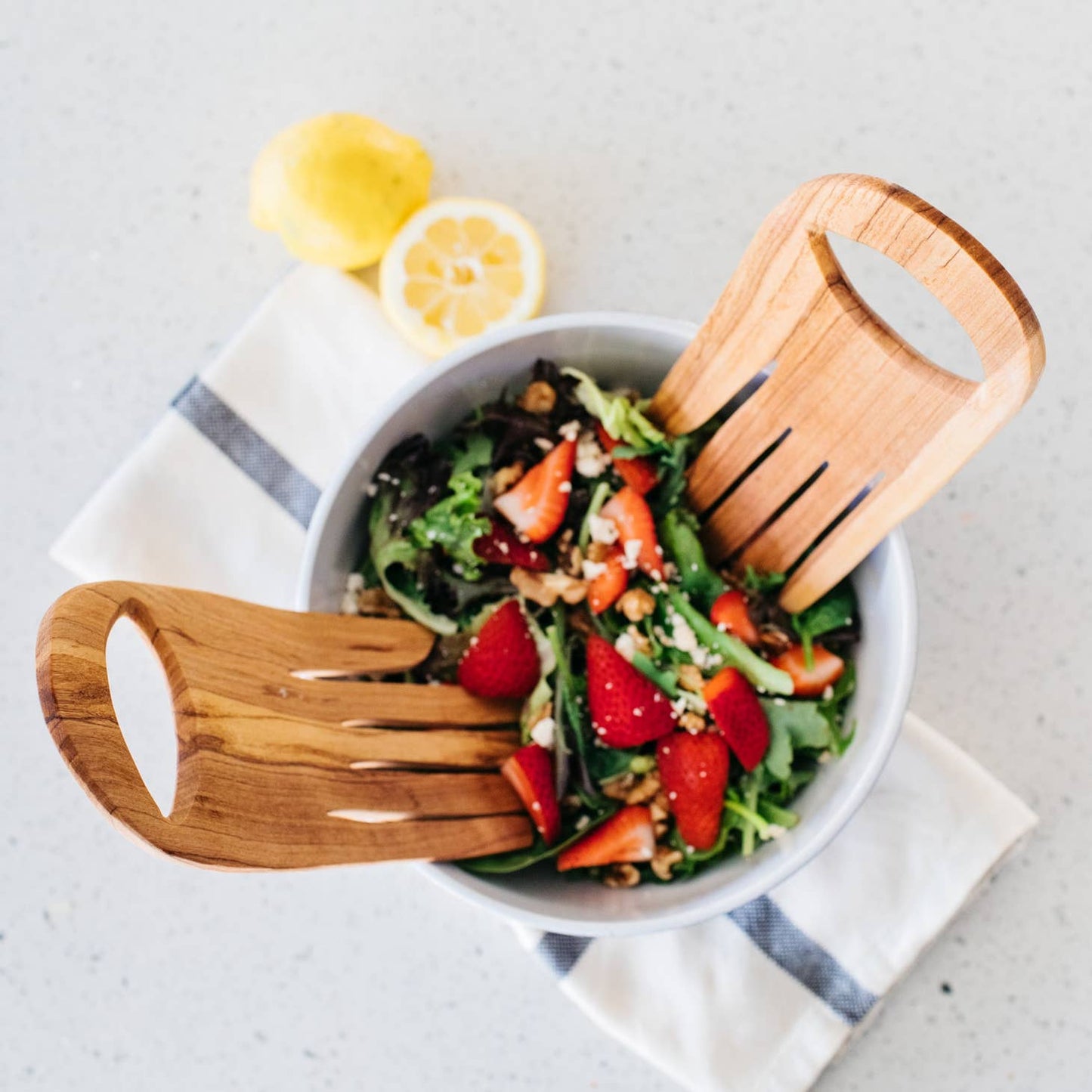 These serving hands are perfect for salads & shaped from durable olive wood. Wild olivewood has a rich grain and is indigenous to East Africa. Ethically made in Kenya.