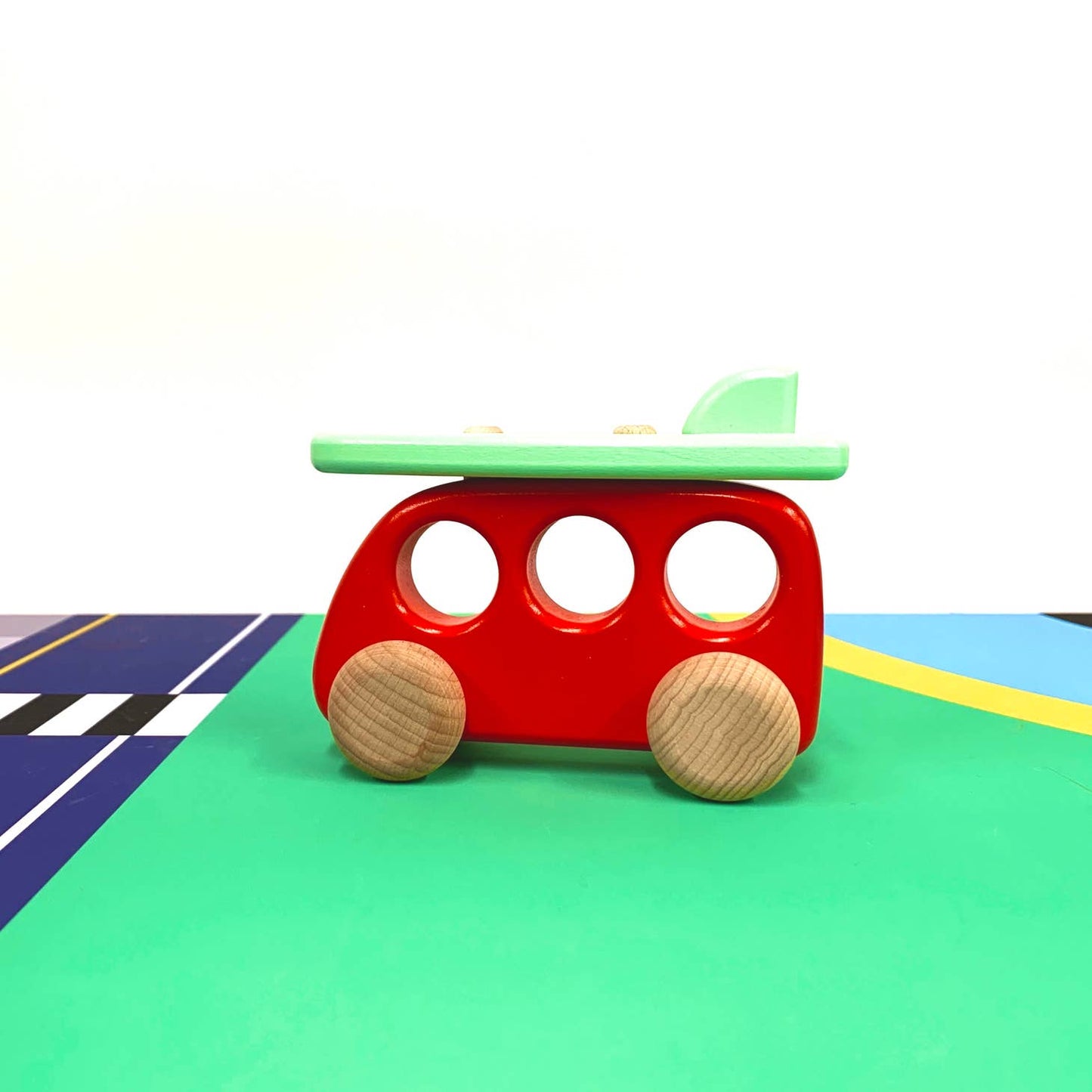 Wooden car with removable surfboard made sustainably