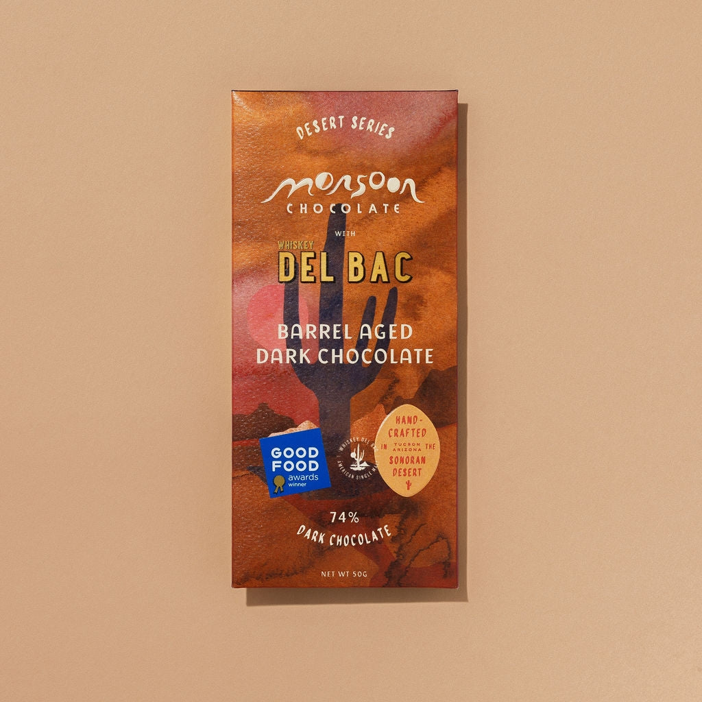 Heirloom chocolate bar with tasting notes of dark fruit, oak, and whiskey.