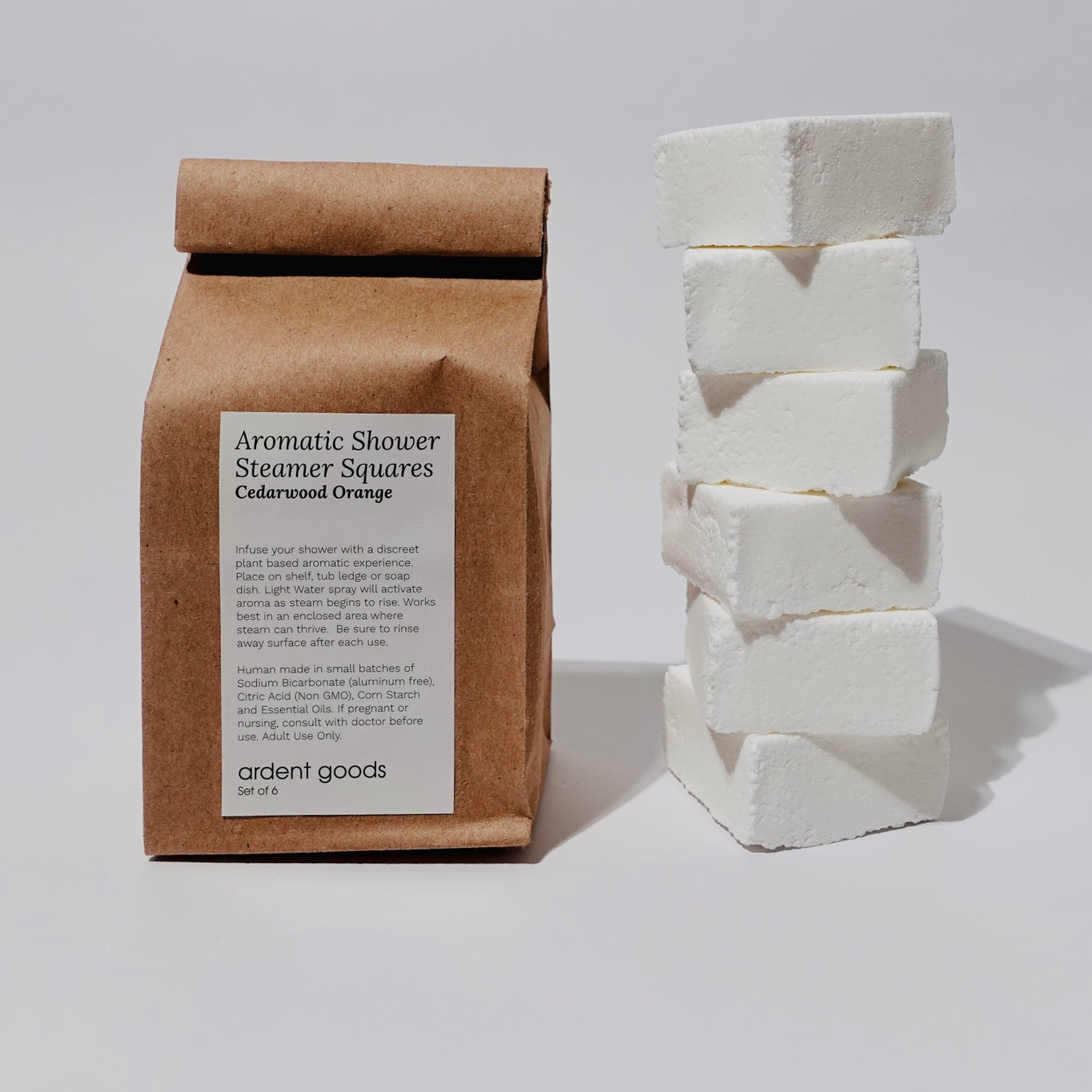 Set of six orange and cedar essential oil shower steamers.