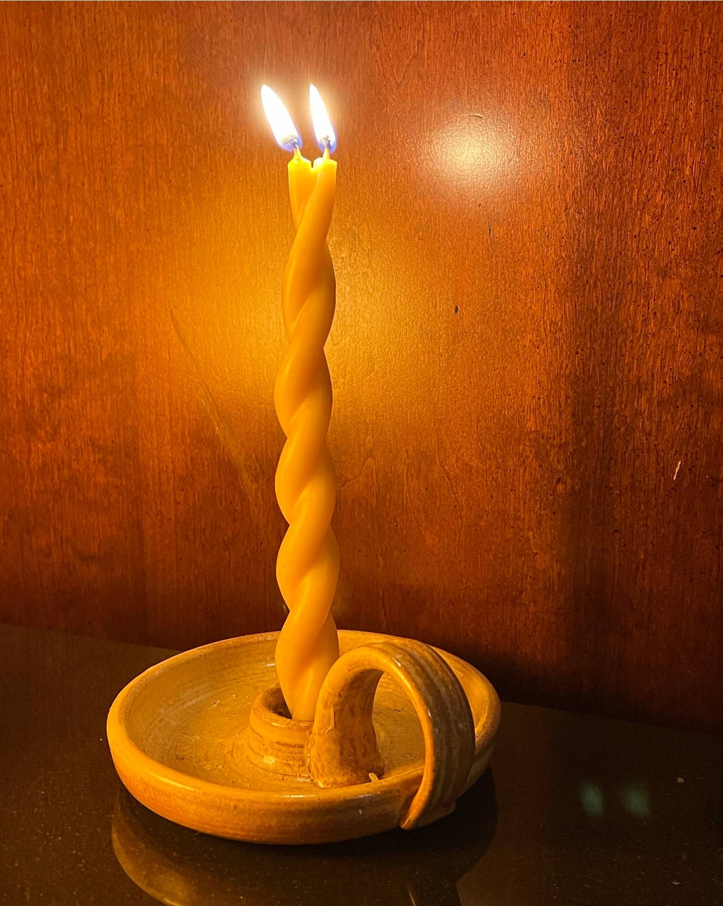 Hand dipped layer by layer and twisted with care, 100% beeswax taper candles. 9" long with a burn time of 3 hrs. Hand dipped taper candles burn longer, with greater integrity and less drip than tapers formed by pouring into molds.