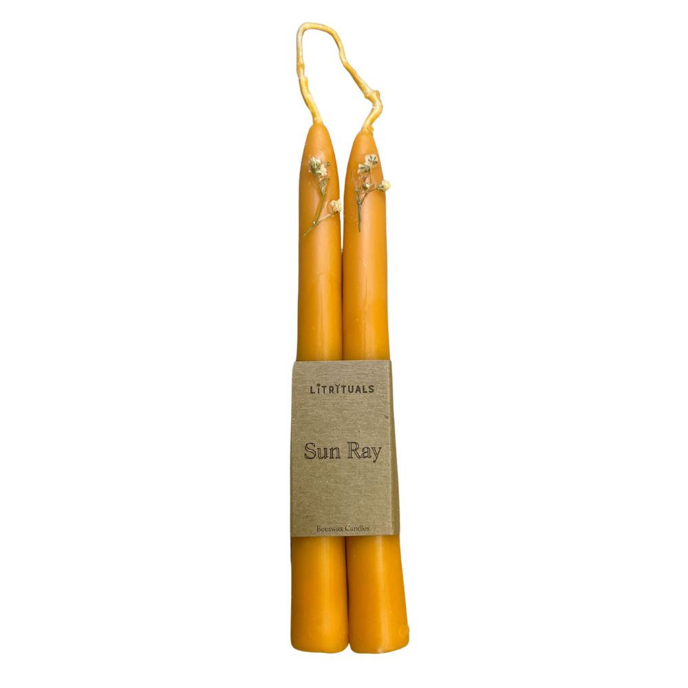 Handcrafted with 100% beeswax and natural dyes, these candles retain their vibrant tangerine hue and exquisite adornments while evoking the sensation of basking in the warm embrace of a summer sun.