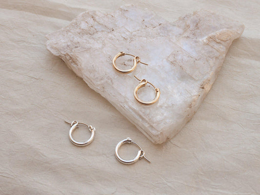 Click hoop earrings might be basic, but never boring. Just the right size to put them in and forget about them but still manage to look put together, a total win! Sterling silver or gold fill, featuring hollow tubes with click-close mechanism. Designed and handmade in Los Angeles.