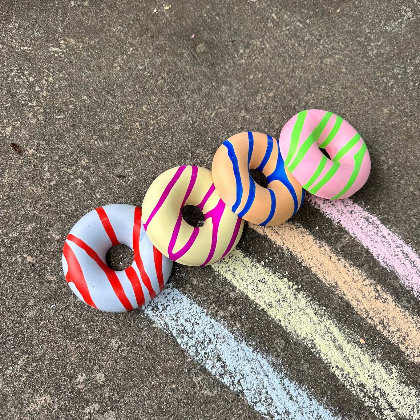 Grab one of these hand painted donuts for outdoor fun this season! With acrylic paint on top of vibrant colored chalk, you are sure to create something unique and special! Eco-friendly, non-toxic, washable.