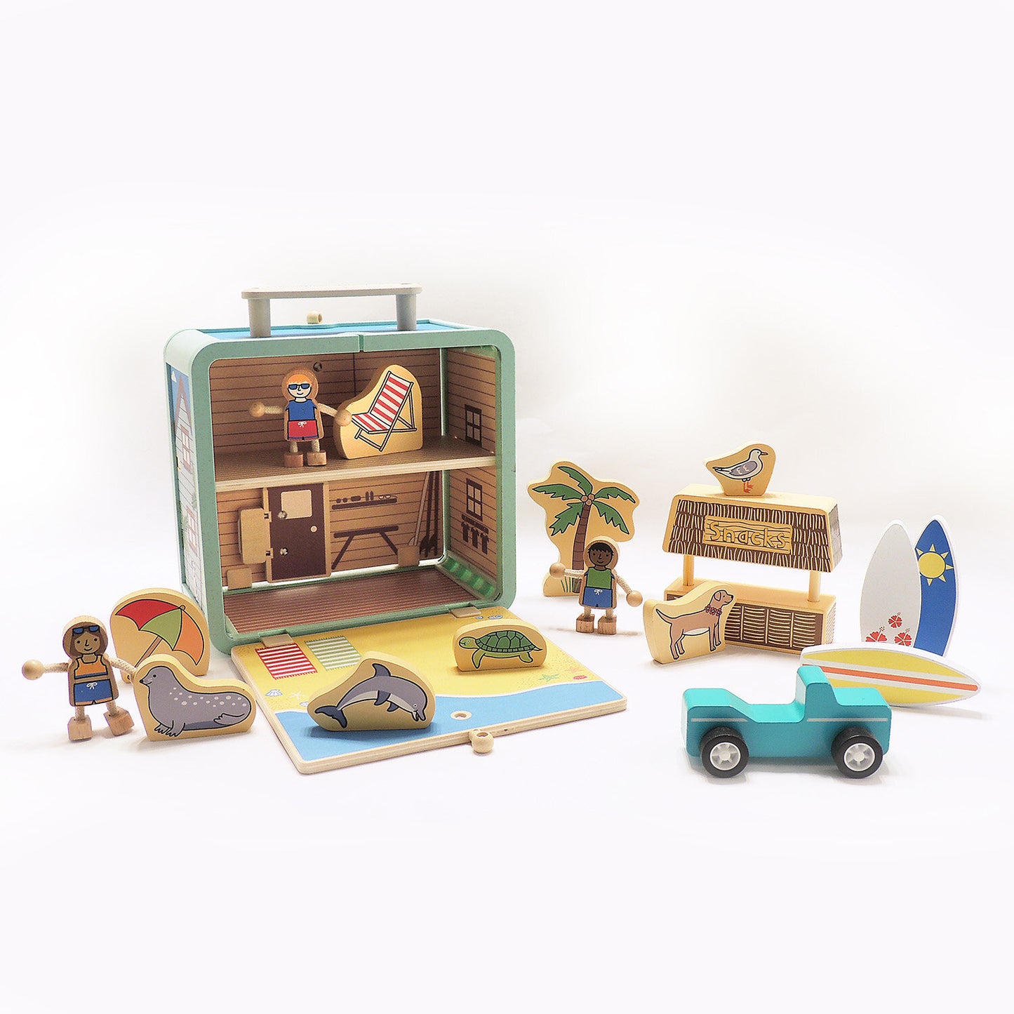Suitcase Series encourages portable play. Each suitcase opens up on both sides to reveal a world of fun.
The 17-piece Surf Shack has everything for fun on the go, including surfer kids, surf boards, a dog, dolphin, snack shack, and more!