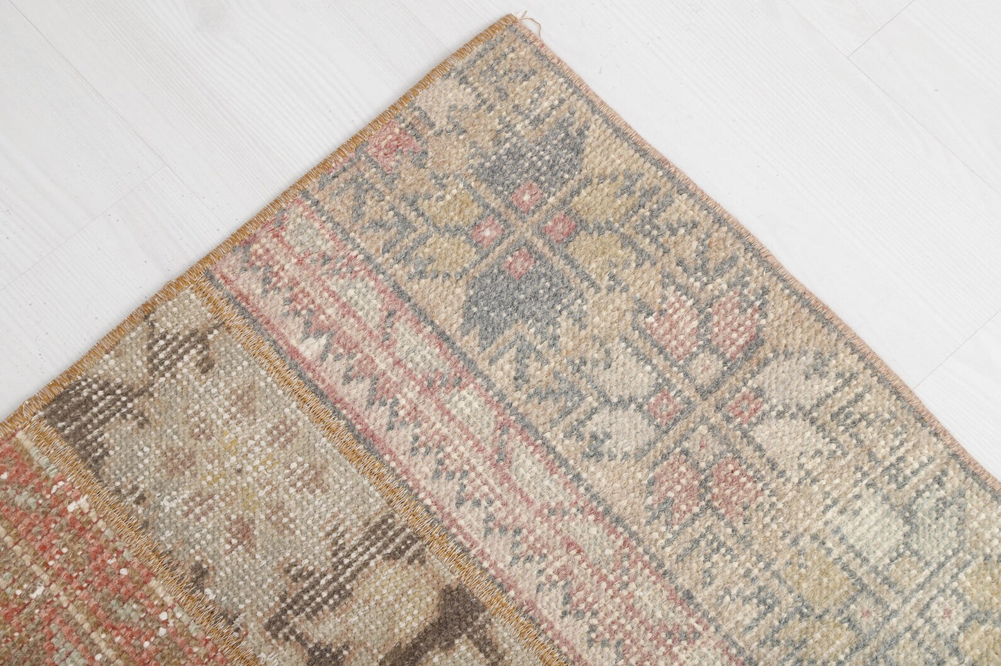 Gorgeous vintage rug from Turkey with earth toned colors and intricate, yet subtle designs. Measures 3.4 x 4.7' and made from 50% cotton and 50% wool. This Turkish rug has been professionally washed before we received it so it is 100% clean and ready to use.