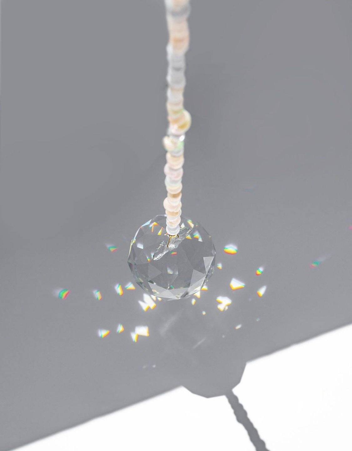 Adorn your space with a window prism - hang in a sunny spot & watch the rainbows dance! In need of a little peace & quiet? Blue Lace Agate & Pearl pair washes away tense energies & pulls in tides of relief & tranquility. Designed in California by Carrie Marill.