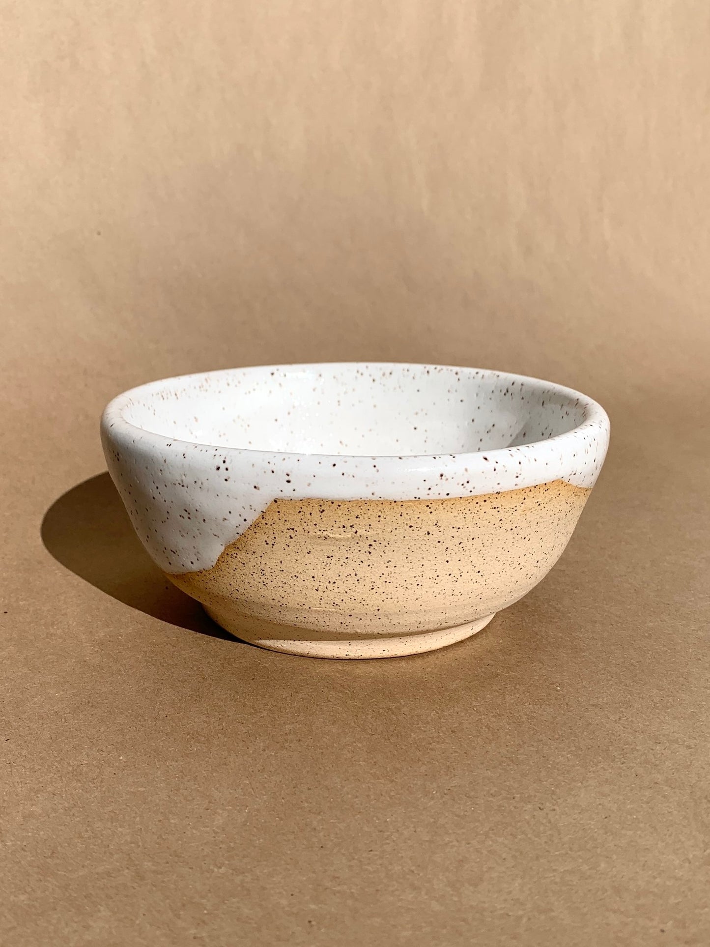 Beautiful smooth bowl great for soup and pasta or simply use it as a catchall. Hand thrown speckled clay with a white gloss glaze.