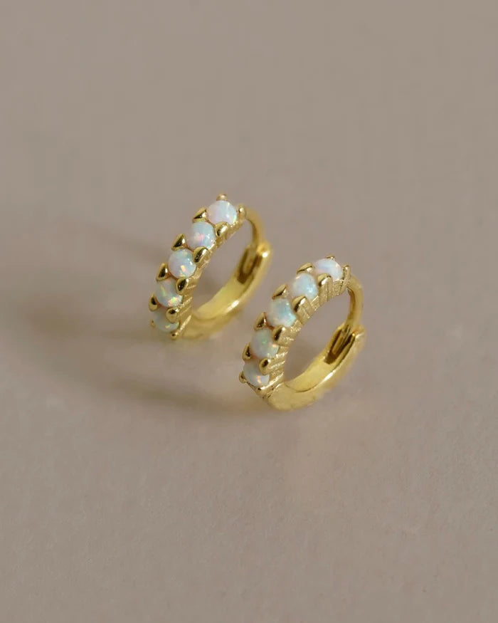 A versatile hoop with colorful Opal stones. This eye-catching everyday earring is a perfect, subtle, understated adornment for any day or occasion. Handmade in the Santa Cruz Mountains.