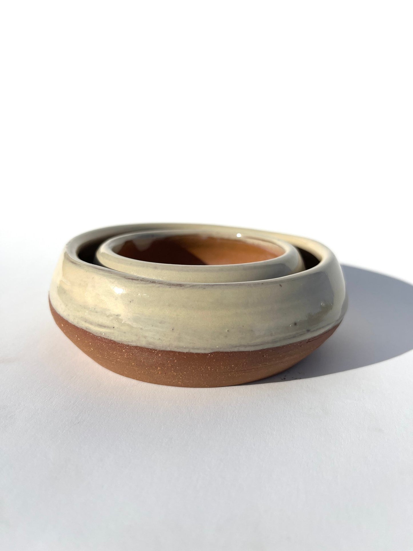 Hand thrown and hand dipped glazed ceramic nesting bowls by Ninth House Goods. A pair of nesting bowls that would be perfect for oil dipping, salsa, or your special jewels and artifacts.