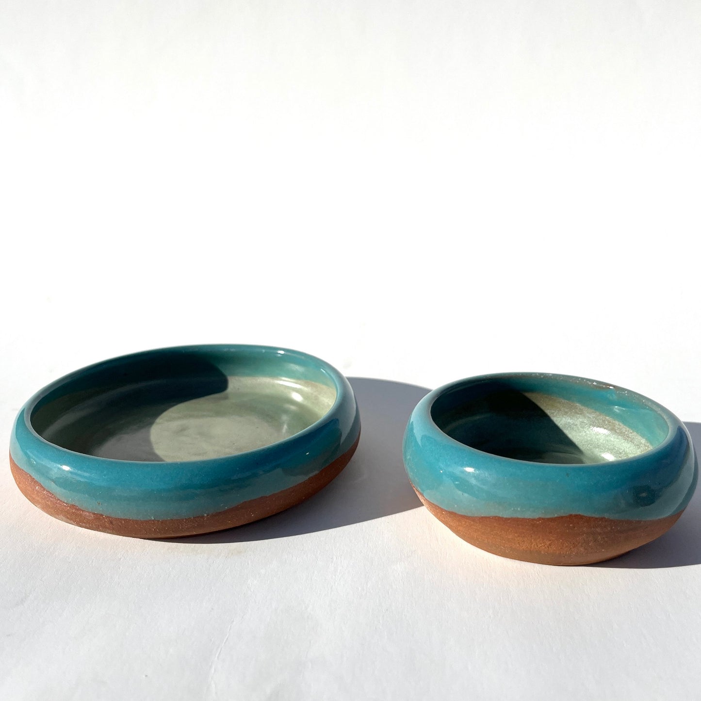 Hand thrown and hand dipped glazed ceramic nesting bowls by Ninth House Goods. A pair of nesting bowls that would be perfect for oil dipping, salsa, or your special jewels and artifacts.