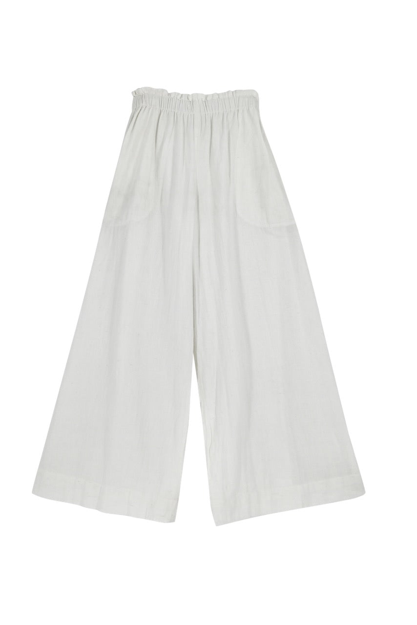 This paperbag waist pant is comfy, roomy, high waisted and wide legged. Wear it seaside with a swimsuit or with your favorite blouse tucked in. Ethically made in India.