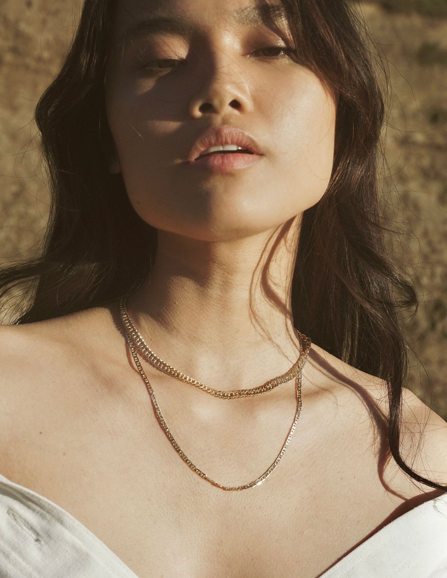 A simple braided chain intended to provide a ring of protection and luck when worn. 18k gold filled chain. Handmade in the Santa Cruz Mountains.