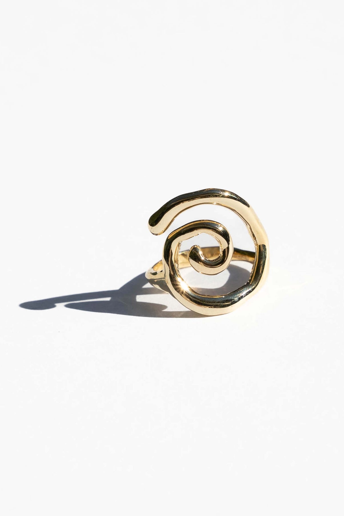 This statement ring is inspired by the fluid and mesmerizing movement of seaweed underwater. Hand carved and cast with a high polish mirror finish. Each swirl is a bit unique in shape. Available in solid brass or sterling silver.