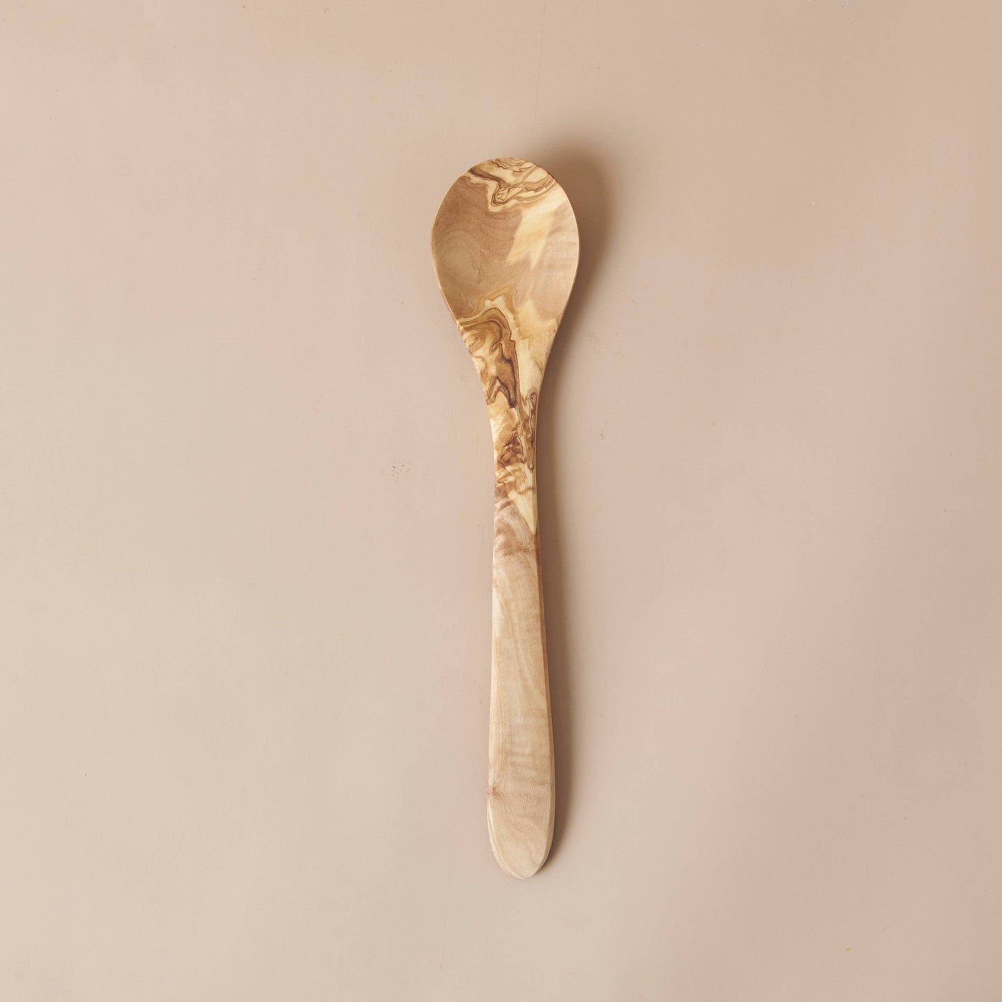 Handcrafted in Tunisia using natural olive wood from the region, this kitchen utensil is hard, durable and non porous. Each piece is unique and becomes even darker, richer and more beautiful in color as it ages.