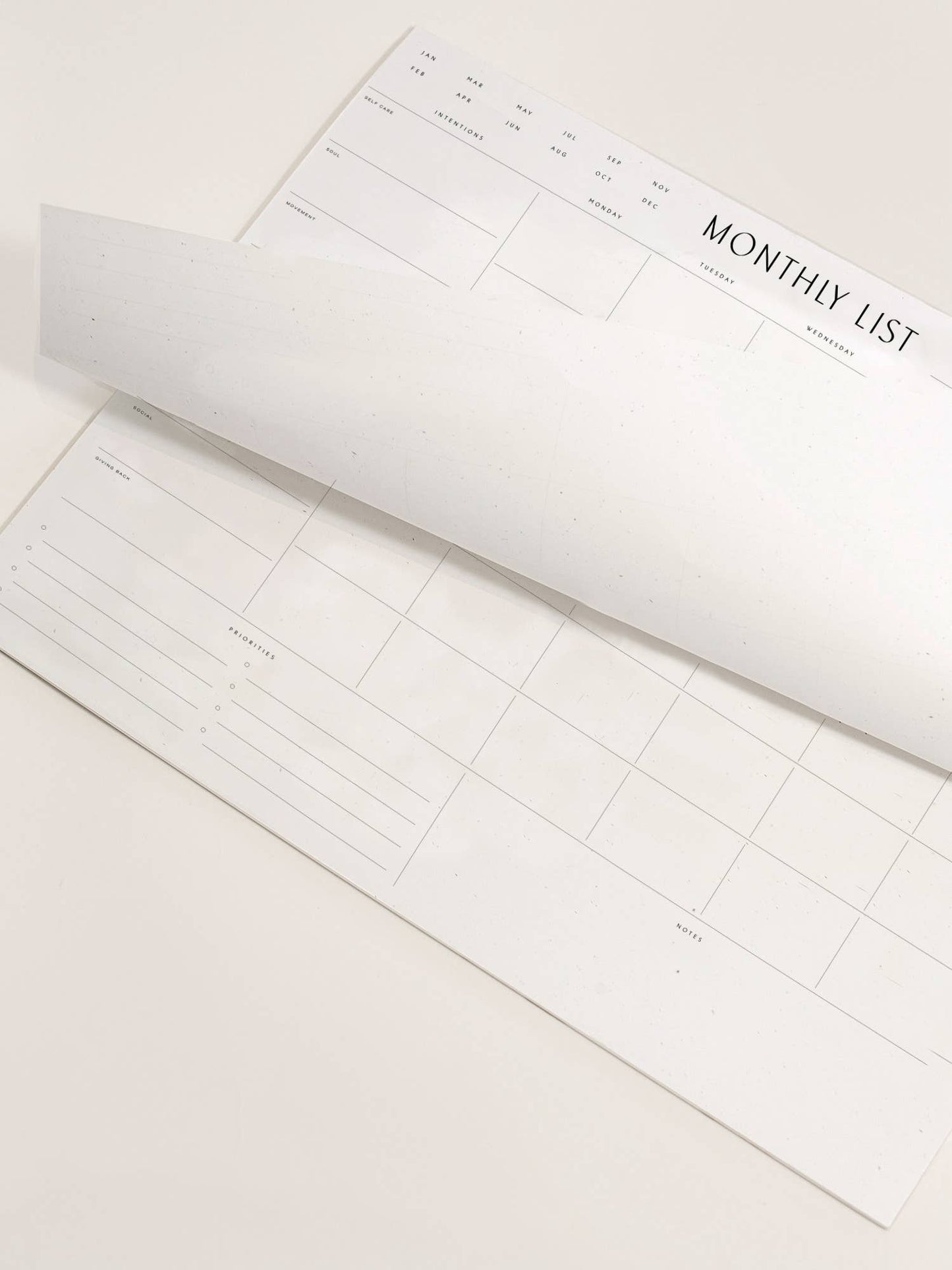 A minimal pad from Wilde House Paper; Introducing the new & improved minimal desk accessory to organize your month & be your best self. Made with recycled paper.