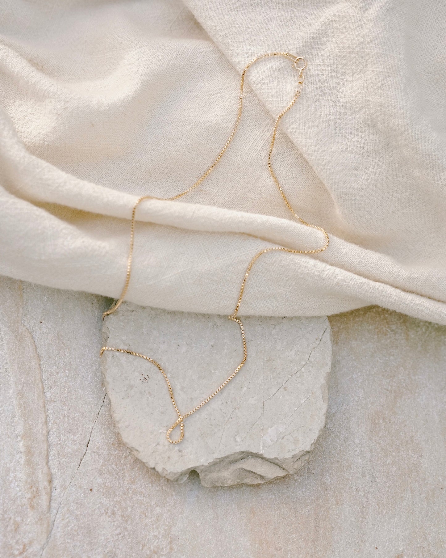 A delicate light weight classic box chain that’s light as air and catches the light just right, perfect for layering or adding a favorite pendant. Handmade in the Santa Cruz Mountains.