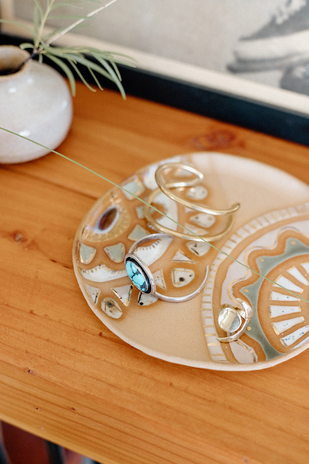 Handmade ceramic dish featuring fun designs and gold luster accents.