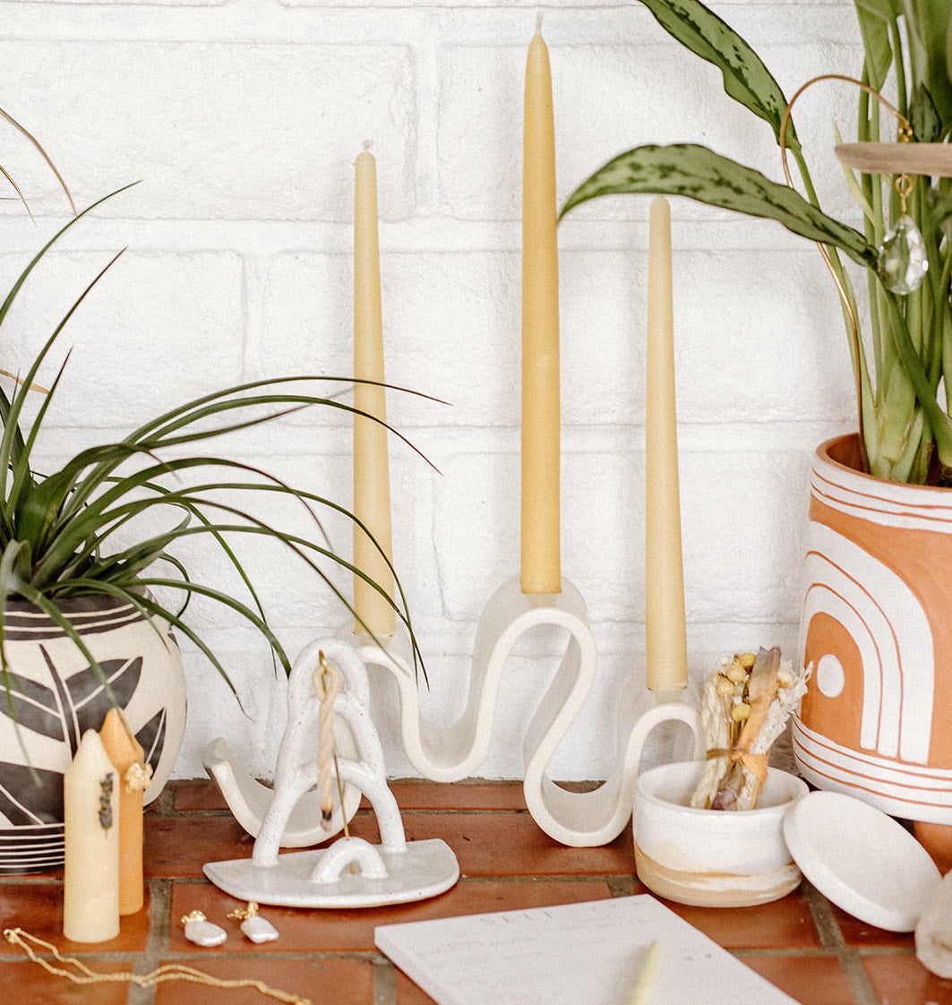 Meet Wyat: A stoneware candelabra with indulgent waves that support candlelight glow for every joyous dance party or intimate conversation over dinner. Handmade in Brooklyn, NY.
