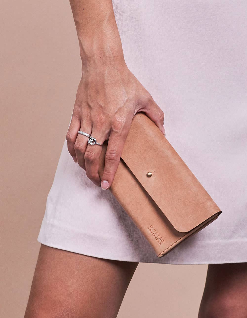 Pixies Pouch has enough space to fit all your needs and closes with a knob button for easy access and an edgy touch. 12 card slots & one main compartment. By O my Bag Amsterdam