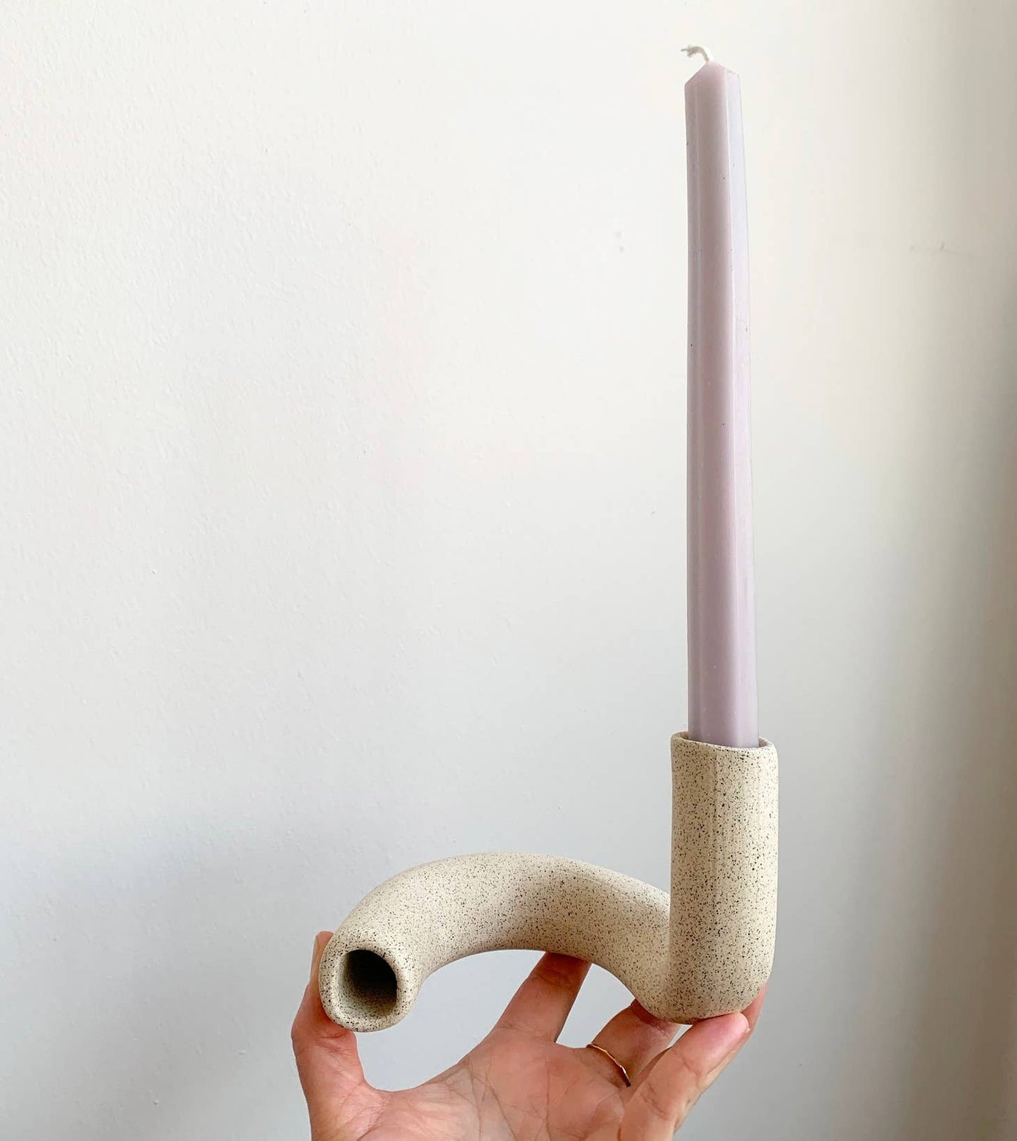 Hand-formed, stoneware taper candlestick holder to add dimension to your table scape. By Janelle Gramling.