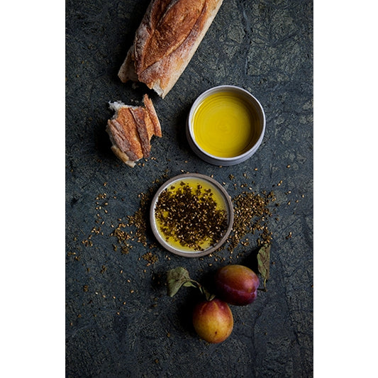 Za'atar is the most beloved spice mix in Palestine.  Canaan's women make za’atar according to tradition with freshly harvested and dried oregano, roasted sesame seeds, and sumac. The fresh aroma of oregano, the acidity of sumac, and the nutty flavor from sesame add up to a winning combination of texture and flavor.