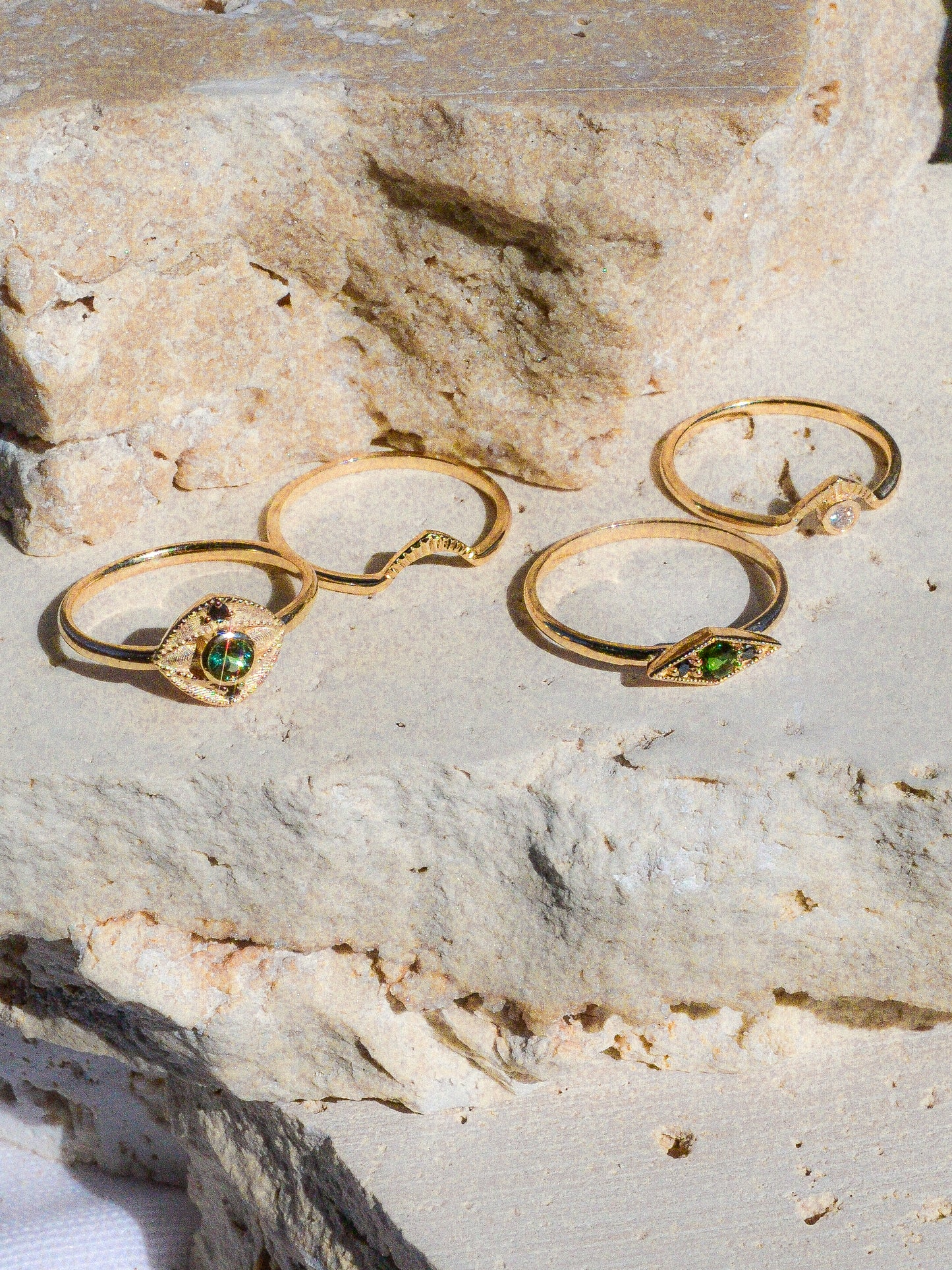 Deep blue green tourmaline encompassed in a diamond shape of solid 14k yellow gold and 2 black diamonds. A one of a kind ring inspired by an island in Scotland. Each Miarante piece is carefully handcrafted in Chicago by a skilled production team.