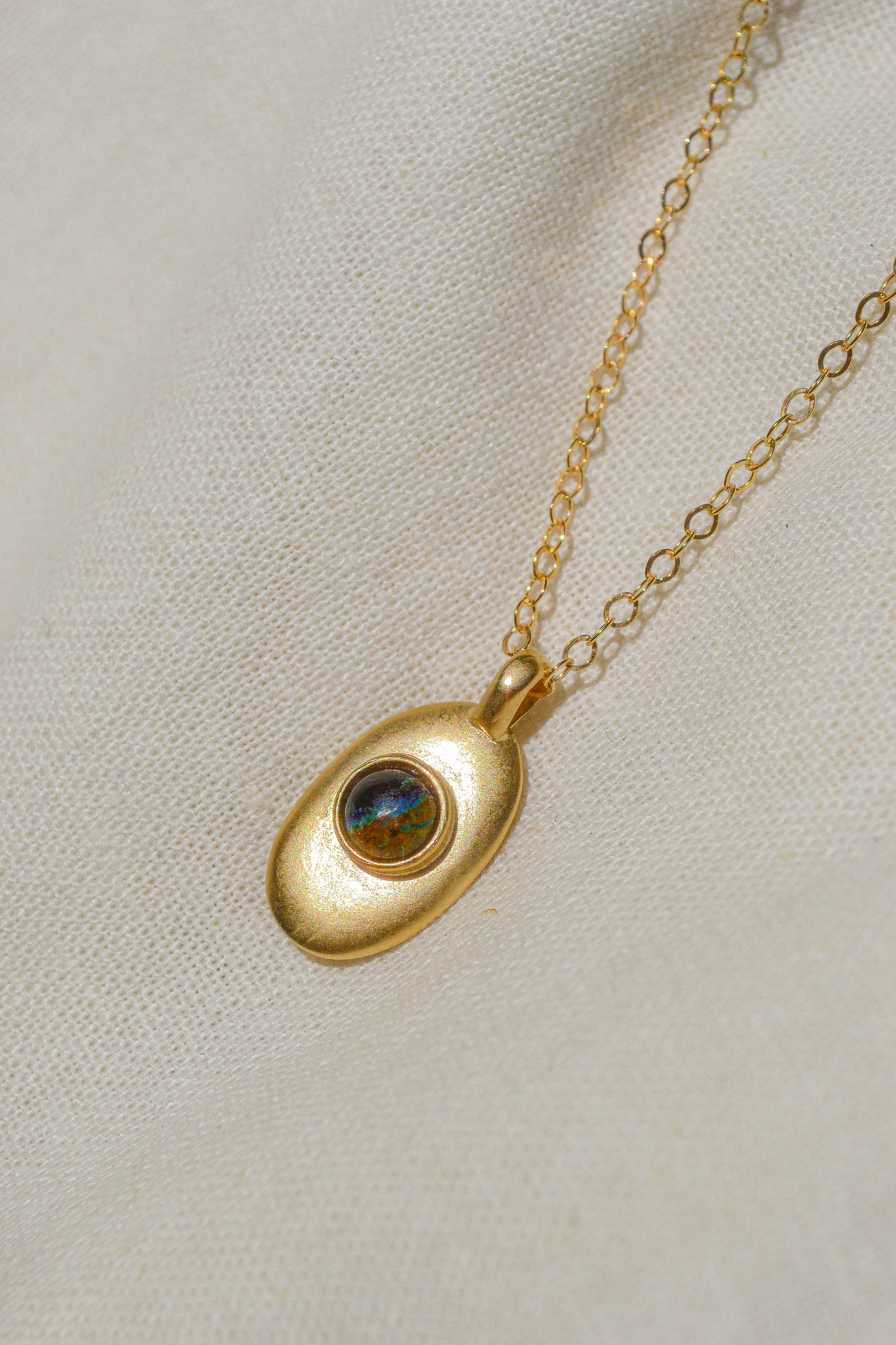 Sweet little handmade charm necklace featuring an ethically-mined azurite stone. Available in bronze with gold plating and a gold filled chain or sterling silver chain.