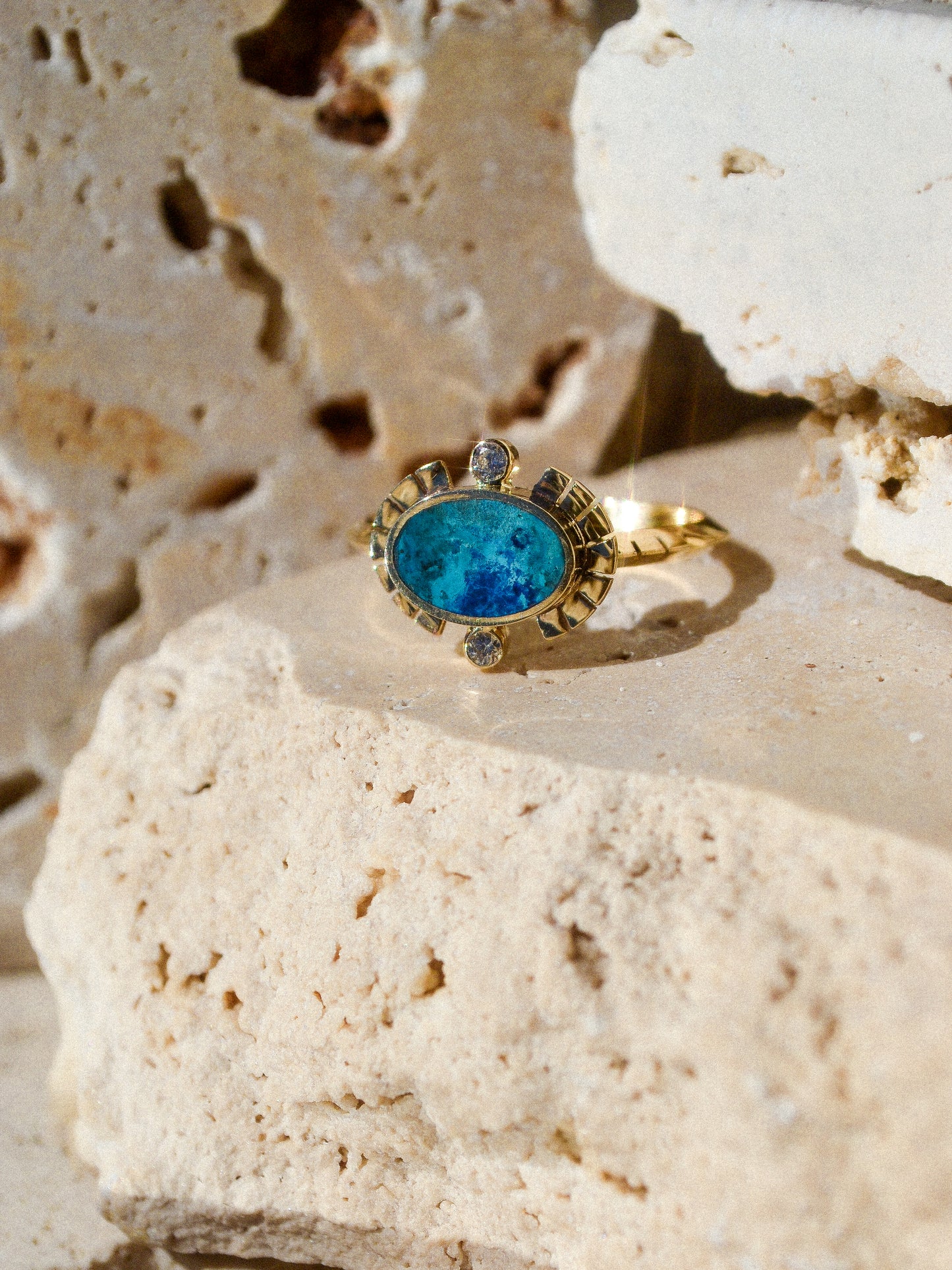 young in the mountains / The Sol Ring features inlaid shattuckite and is a beautiful and classic Young in the Mountains style. The Sol ring features two .03 ct. reclaimed white diamonds bezel set in 14k gold at top and bottom with golden wings at each side.