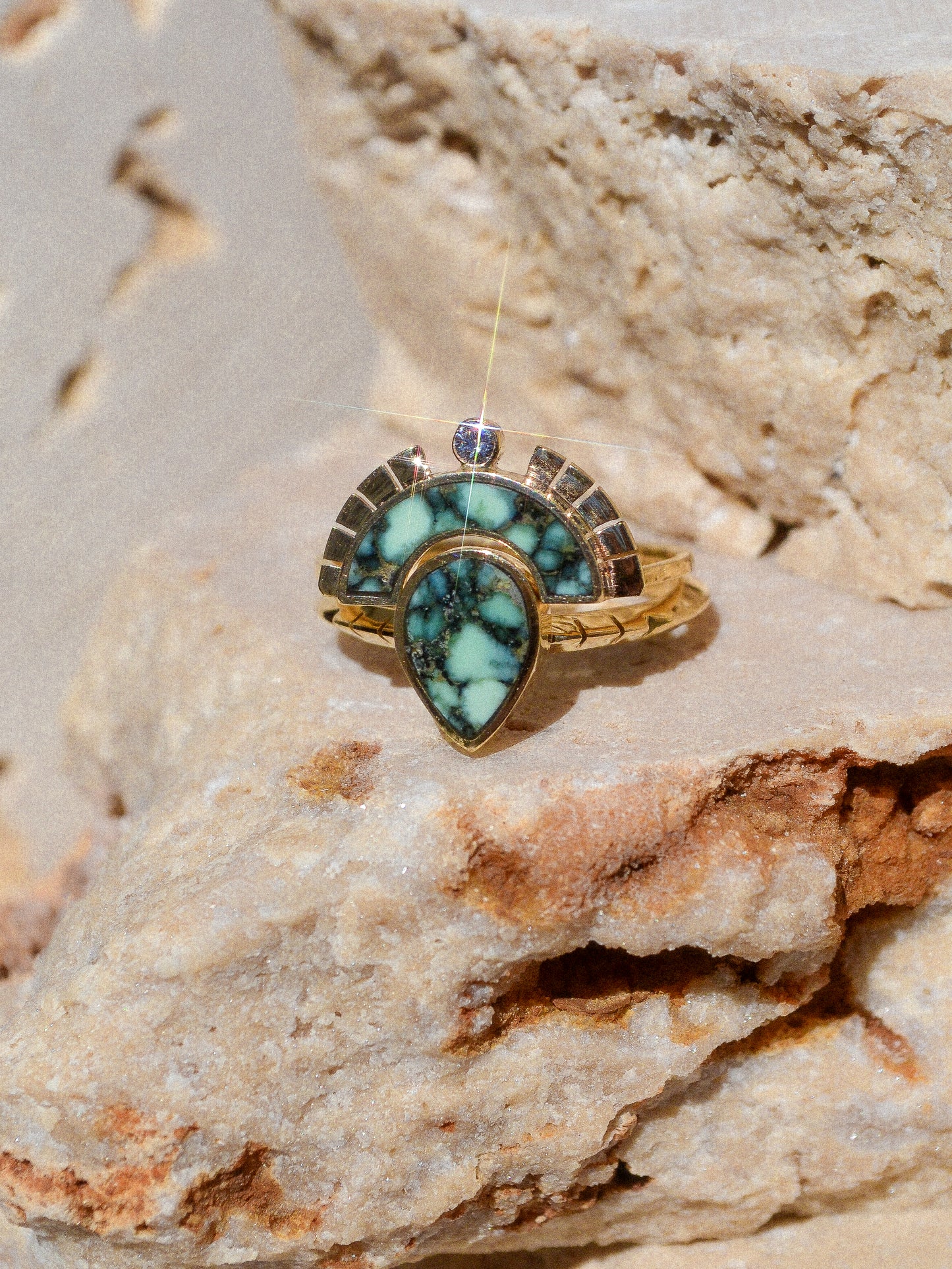RISING SOL ARCH CROWN / The inlaid Angel Wing variscite is hand cut and shaped to fit perfectly inside this 14K gold bezel. A Young in the Mountain signature carved halo features a .03 ct conflict-free white diamond that brings beautiful light to this piece.